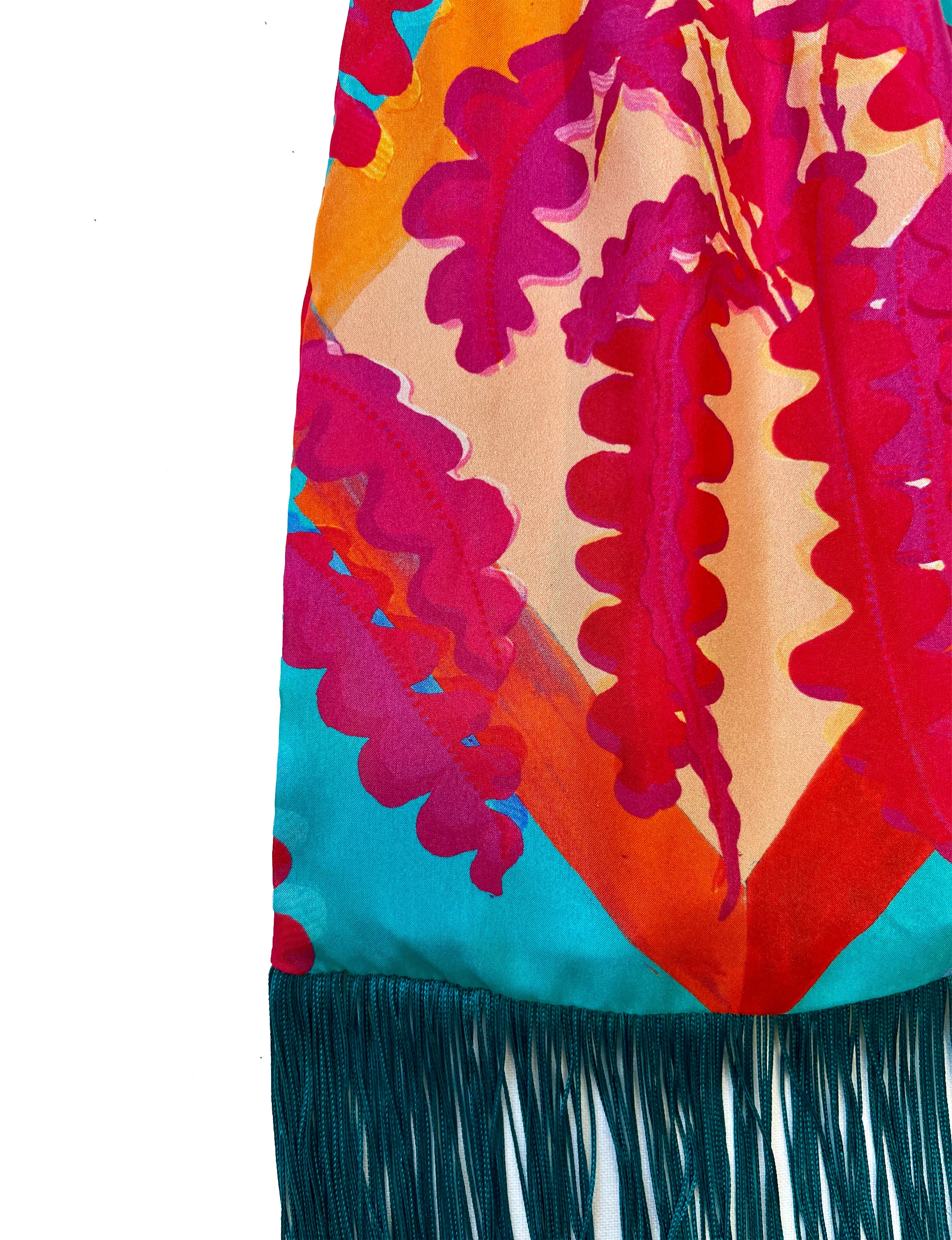 Colourful fabric handbag with leaf pattern and teal fringe 