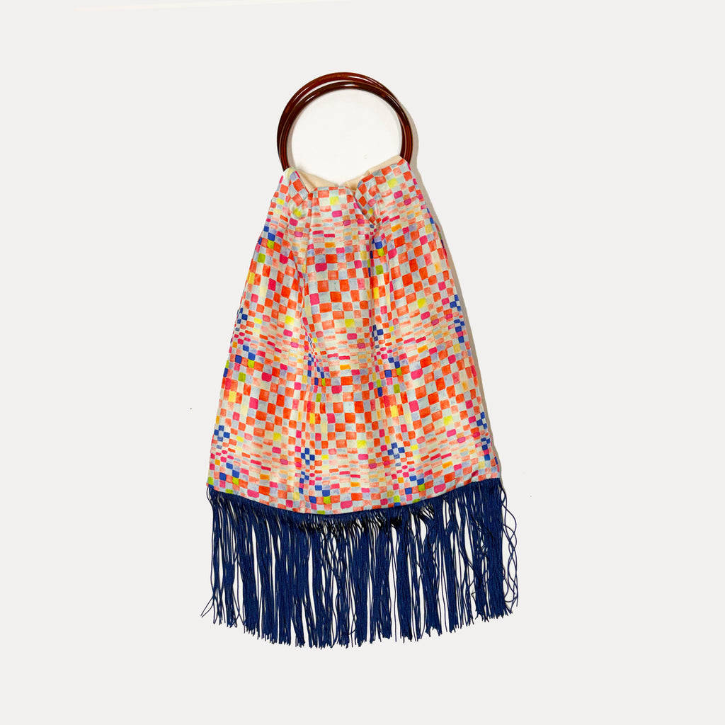 Colorful large silk handbag by Eleni Malami with vibrant patterns and elegant handles, perfect for stylish accessories.