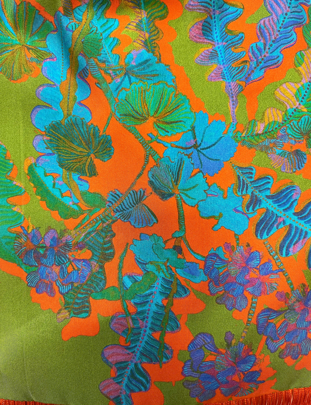 Eleni Malami luxury silk handbag with green and orange geranium fringe, stylish and elegant accessory for women.
