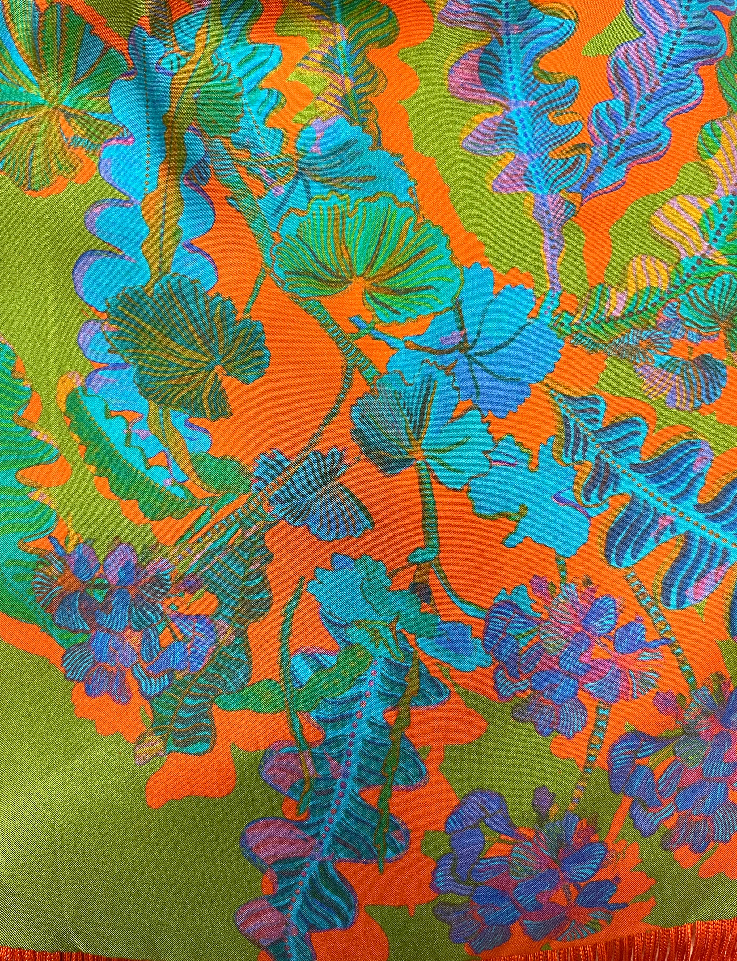 Eleni Malami luxury silk handbag with green and orange geranium fringe, stylish and elegant accessory for women.