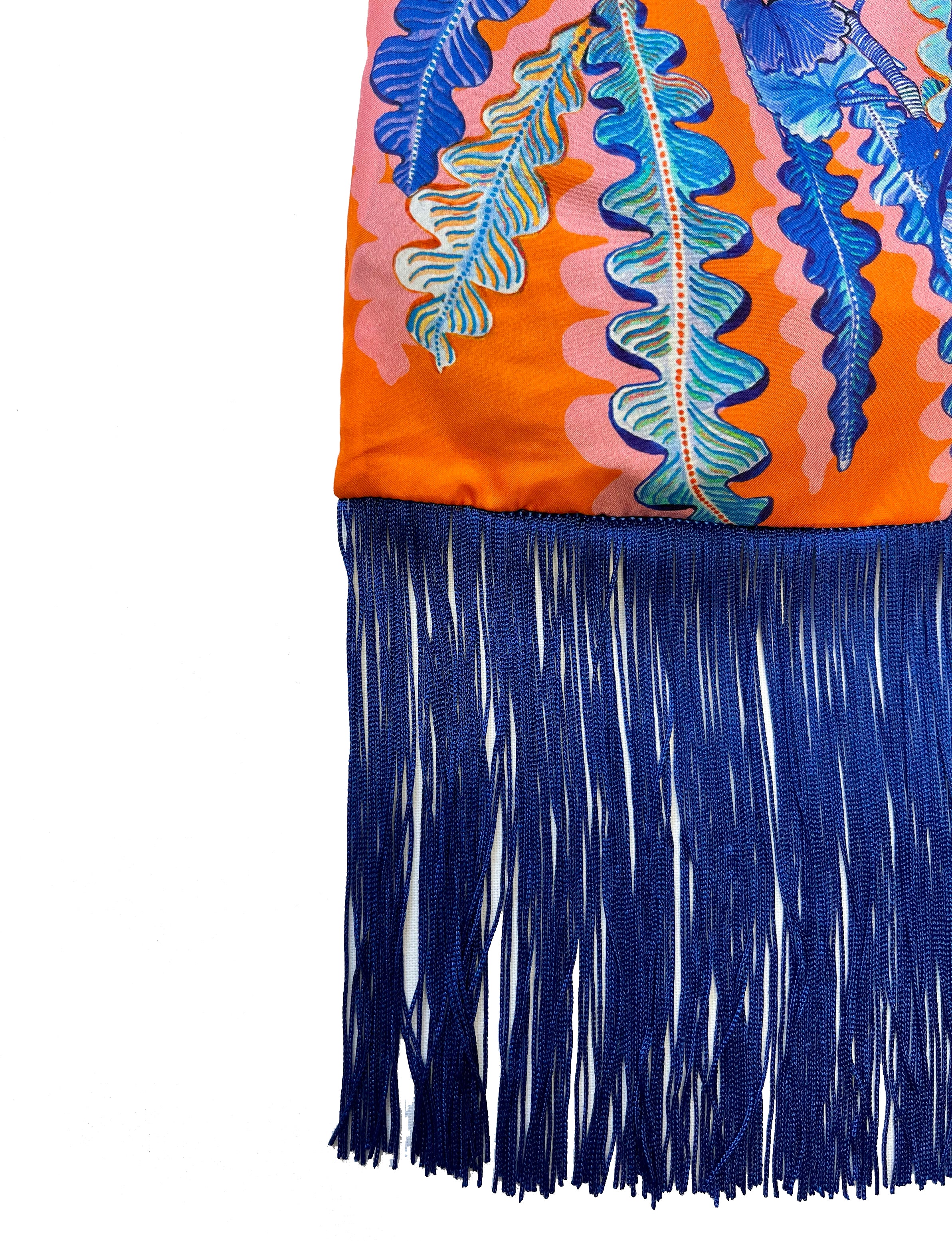 Eleni Malami luxury silk fringe handbag in orange and cobalt with intricate detailing and handwoven design.