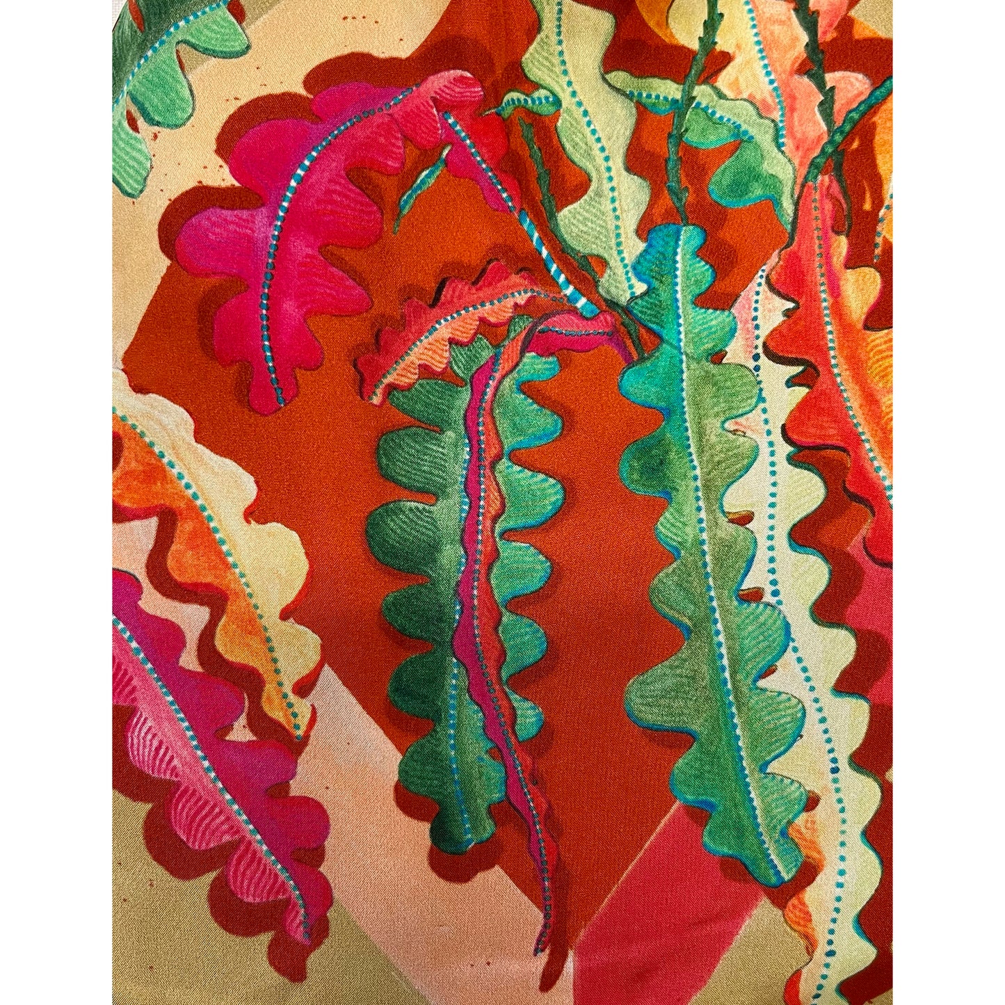 Eleni Malami beige and burnt orange silk luxury fringe handbag featuring elegant handwoven design and decorative tassels.