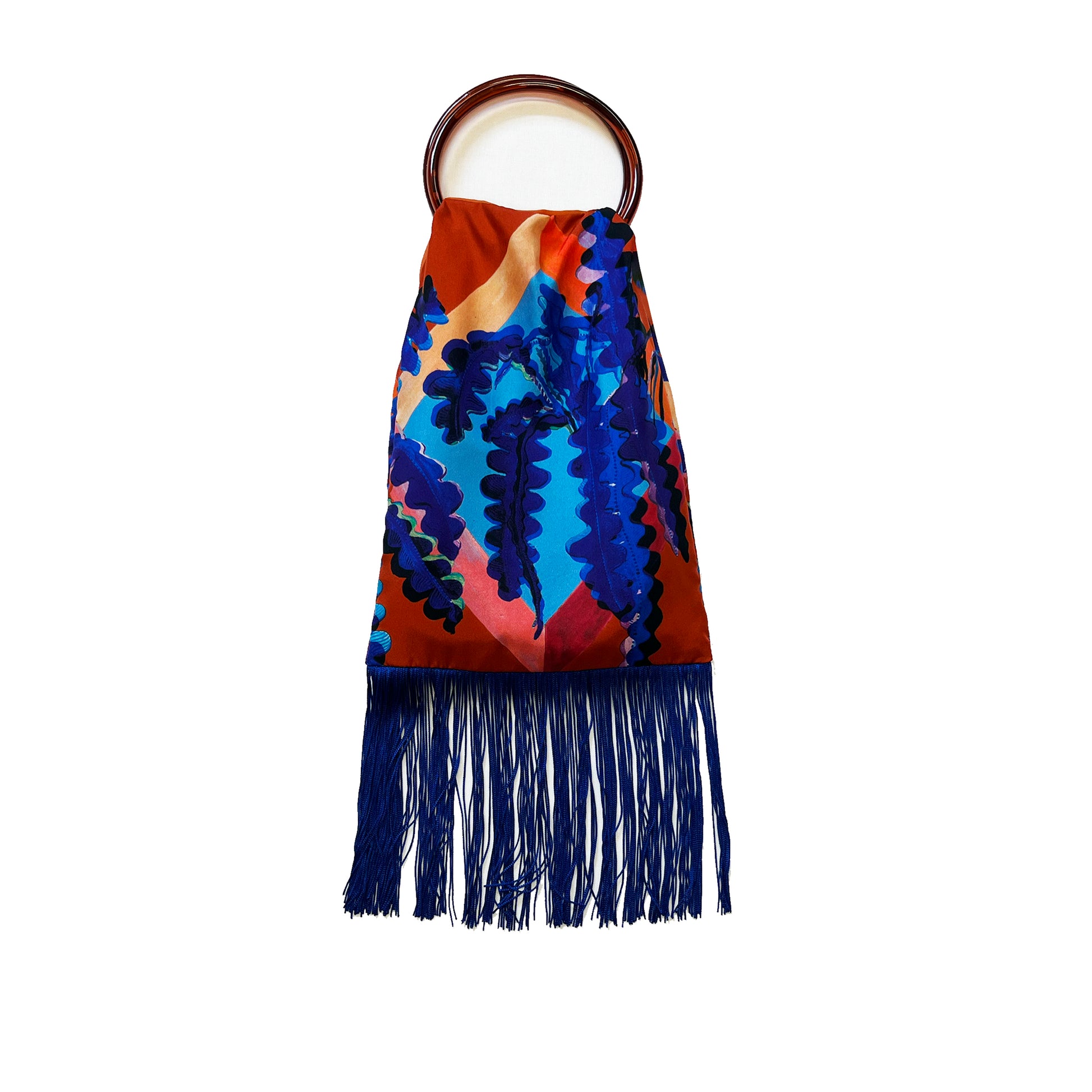 Eleni Malami luxury silk handbag with fern toffee and cobalt fringe, showcasing elegant design and vibrant color contrast.