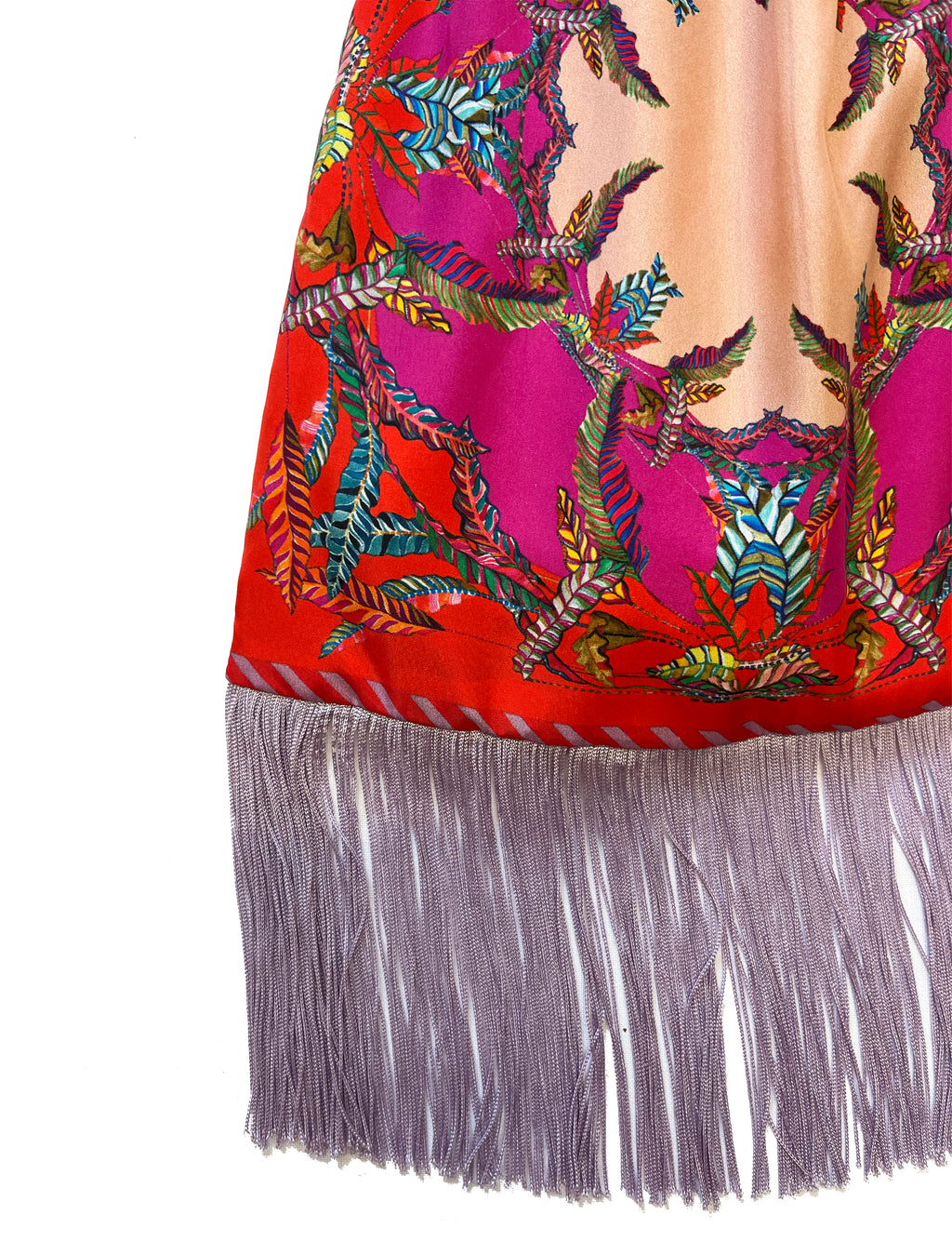 Large silk handbag by Eleni Malami with red and magenta fringe, featuring bamboo handles and luxurious design.